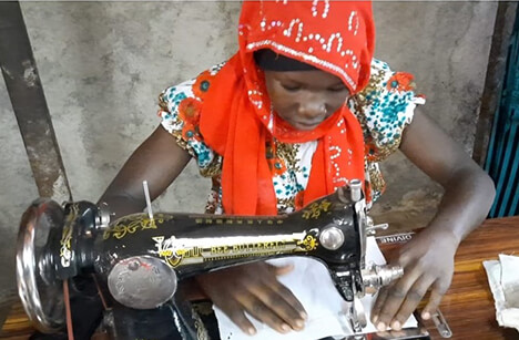 Girl in sewing class